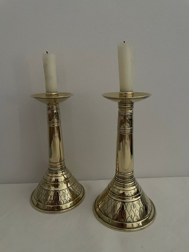 Photograph of a pair of brass candlesticks