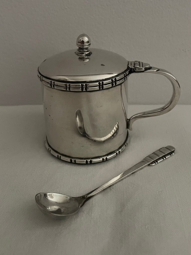 Photo of a silver mustard pot and spoon