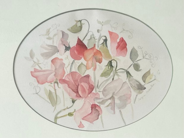 Watercolour of red and pale pink flowers in an oval frame
